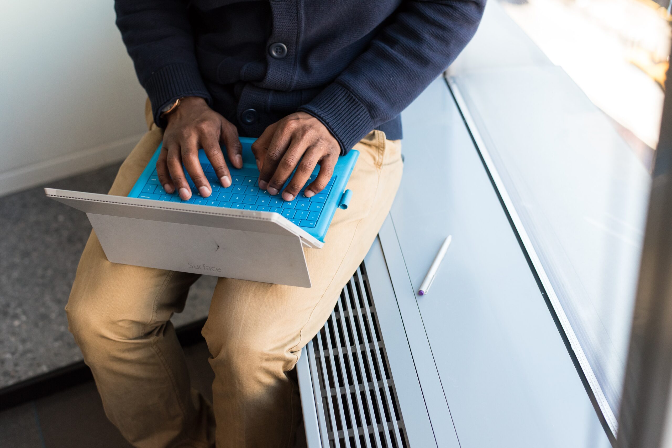 Hands Typing on a tablet Computer