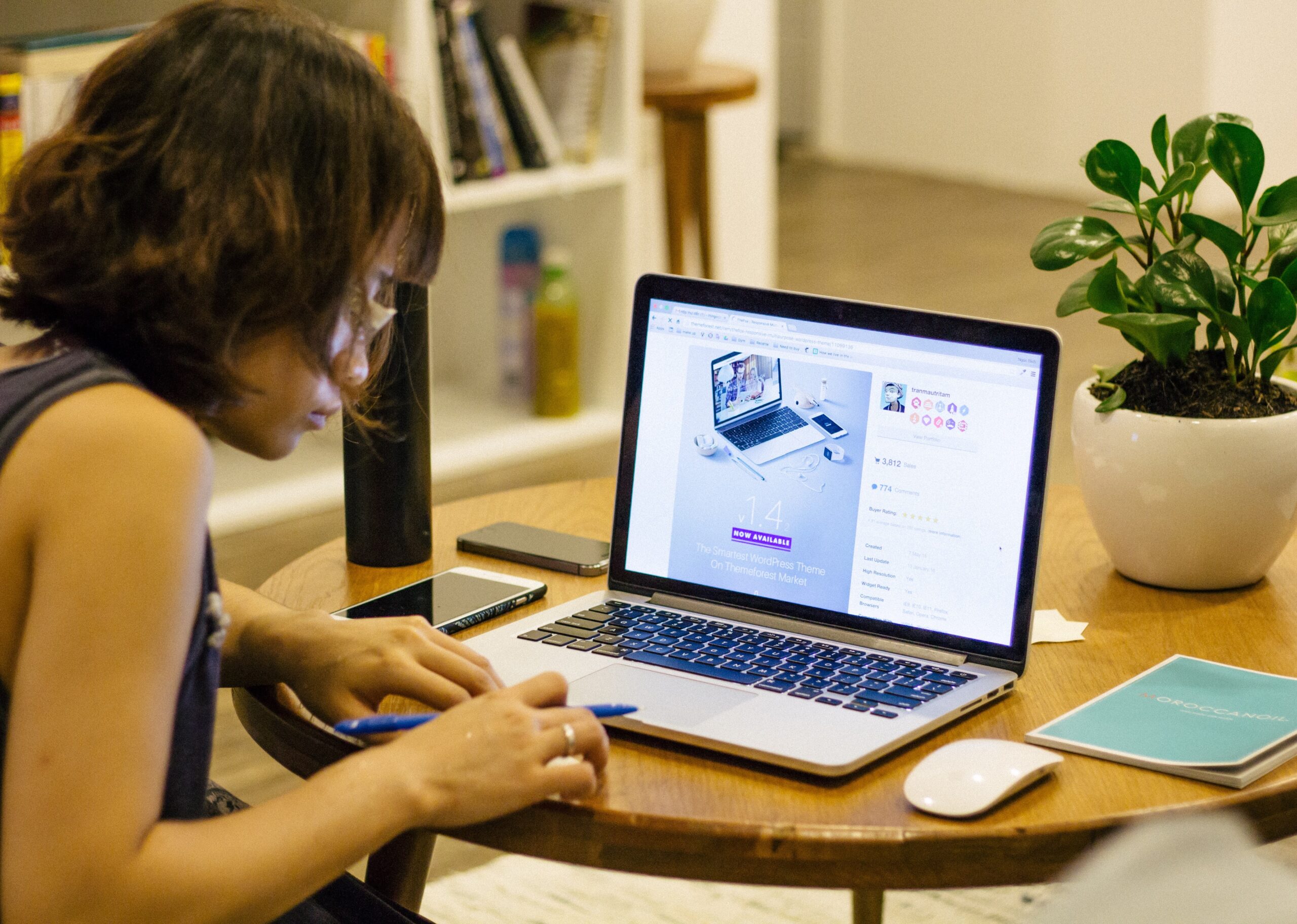Article Cover: Phot of woman using a block editor on a laptop to make a landing page