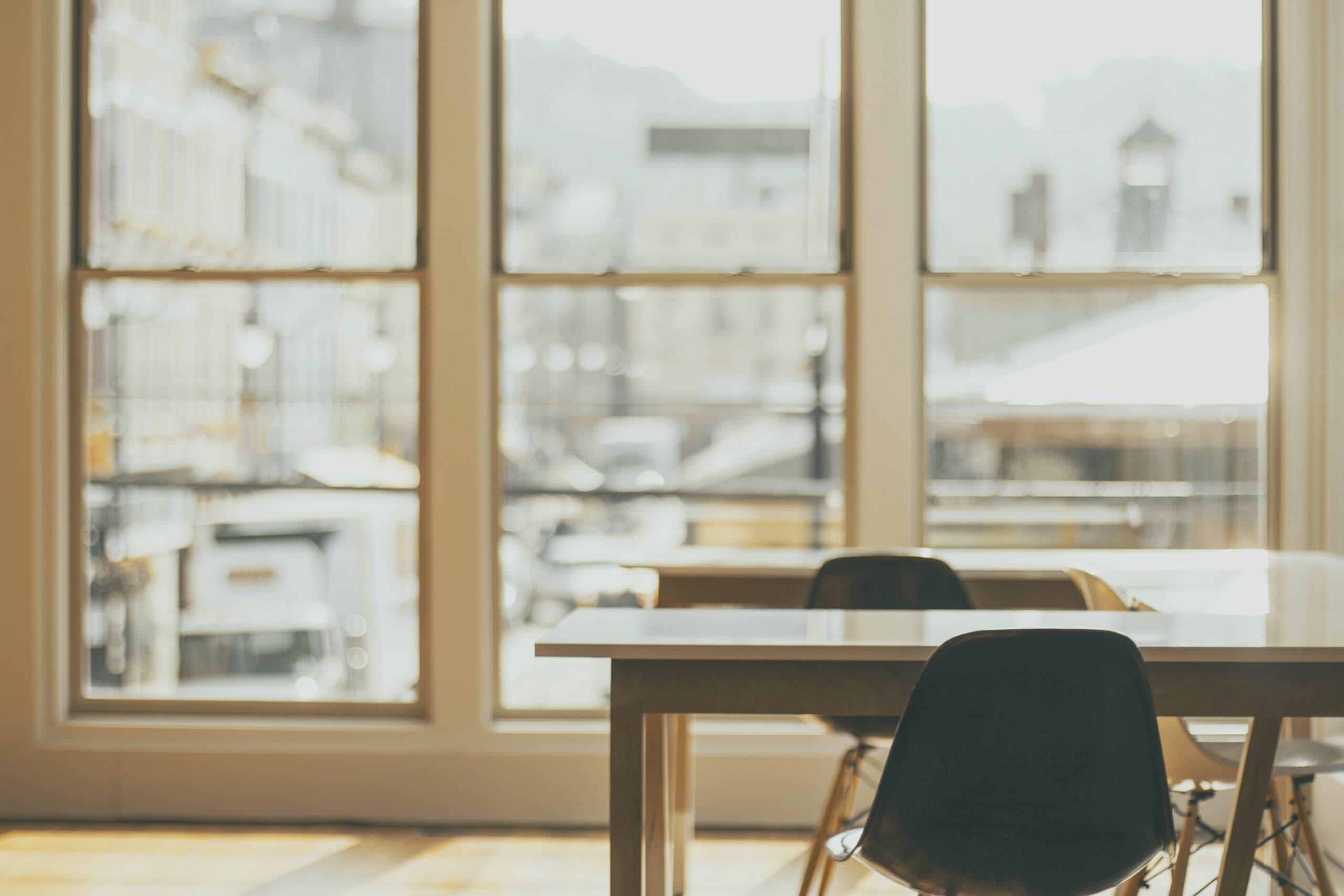 photo of desks in front of windows